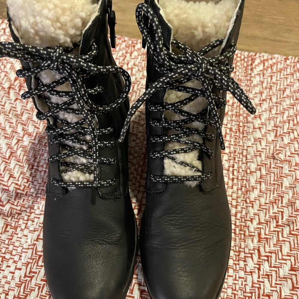 Sorel Emelie Short Lace Cozy boot in black genuine shearling tongue and lining